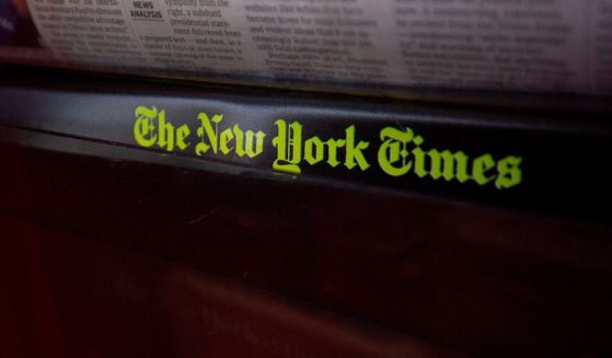 The New York Times logo is seen on a newspaper rack at a convenience store in Washington, D.C., on Aug. 6, 2019.