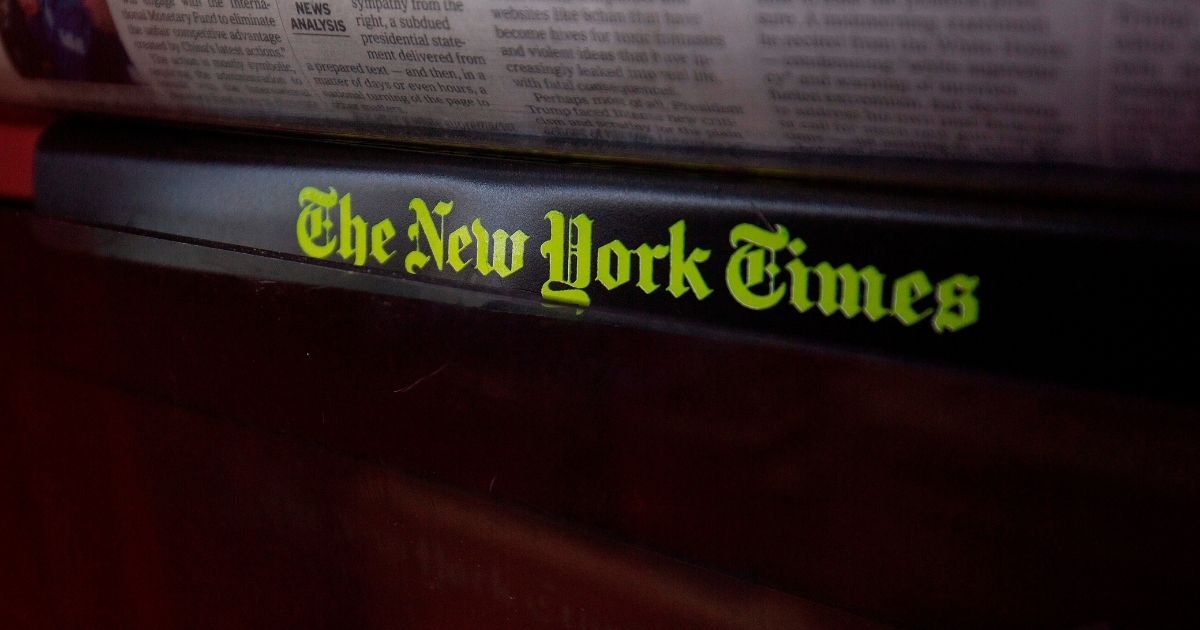 The New York Times logo is seen on a newspaper rack at a convenience store in Washington, D.C., on Aug. 6, 2019.