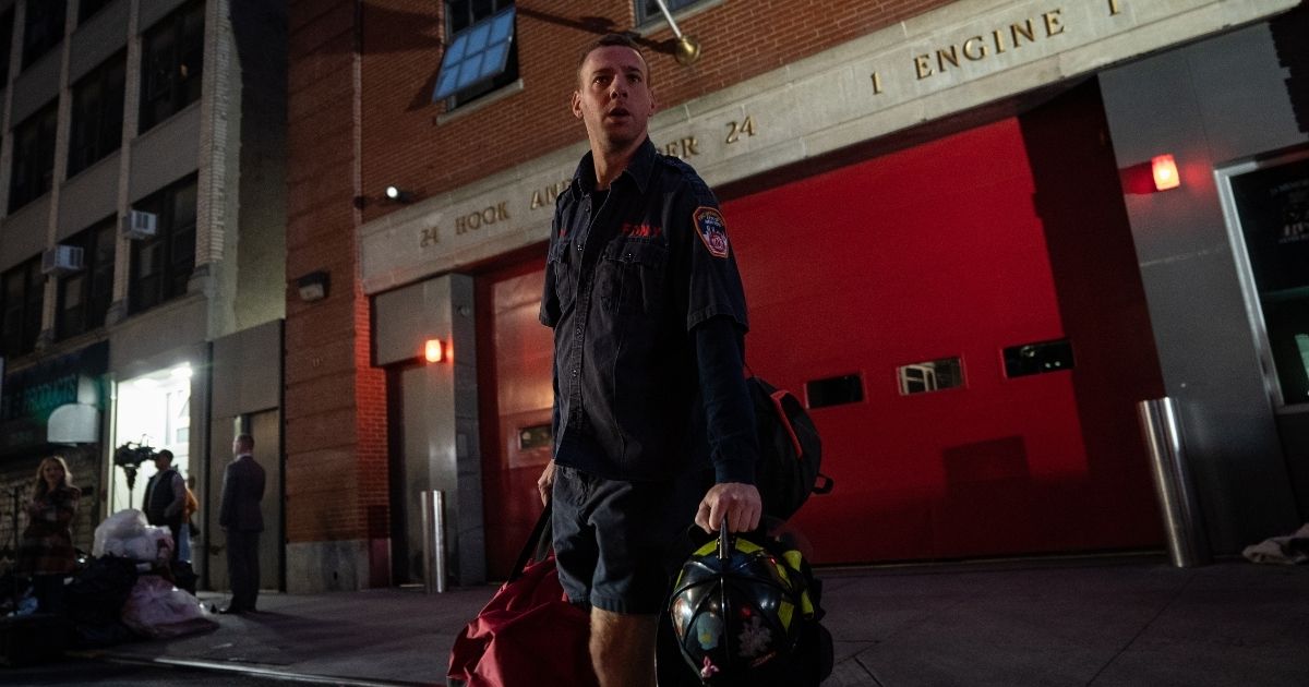 A firefighter departs the station house of Fire Engine 1 to another station house due to a staffing shortage in New York City on Oct. 29, 2021.