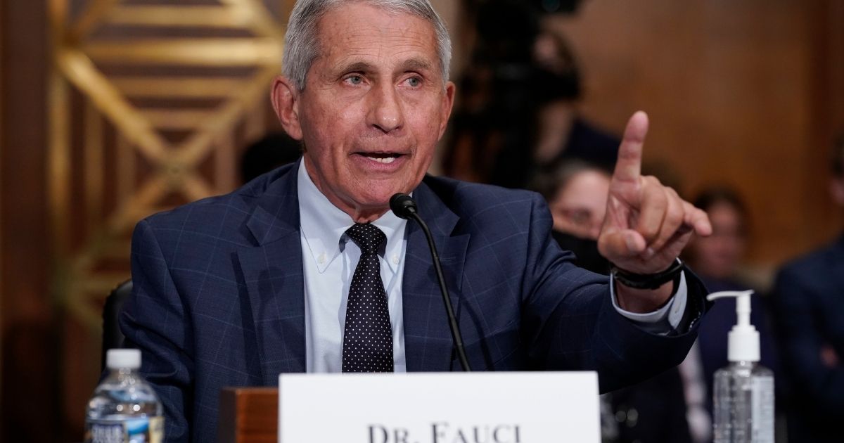 Dr. Anthony Fauci responds to questions from Sen. Rand Paul as he testifies before the Senate Health, Education, Labor and Pensions Committee on July 20, 2021, on Capitol Hill.