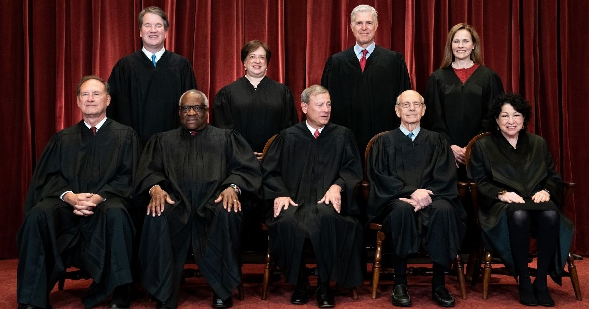 Members of the Supreme Court pose for a group photo in Washington, D.C., on April 23.