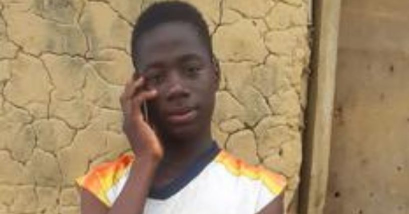 Emmanuel Tuloe speaks on his phone in Gbolor Dialla, Liberia, on Thursday.