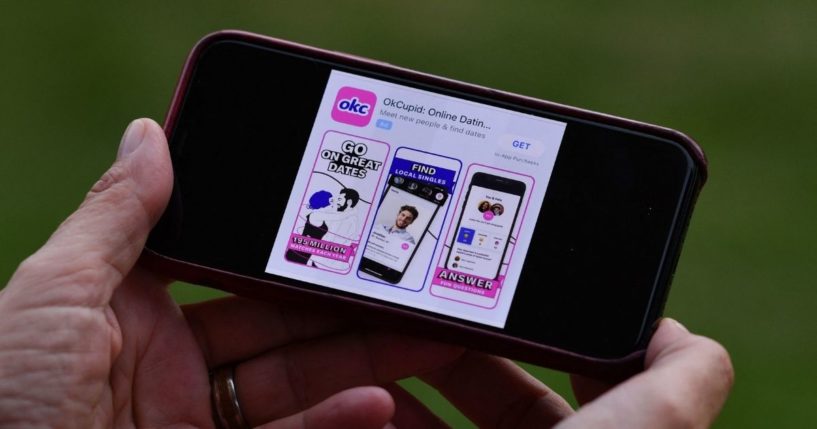 The OkCupid dating app is displayed on a cellphone on Feb. 11, 2021, in Los Angeles.