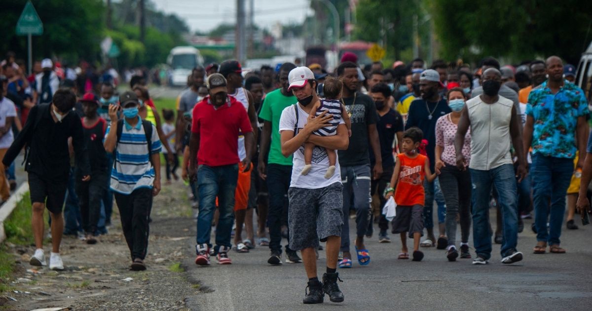 Haitian and Central American migrants march to the Siglo XXI Migratory Station in Tapachula, Chiapas, Mexico, on Sept. 15.