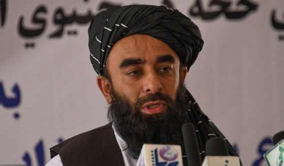 In this Sunday photo, Zabihullah Mujahid, chief spokesman for the Taliban, speaks in Dasht-e-Padula of southern Kabul.