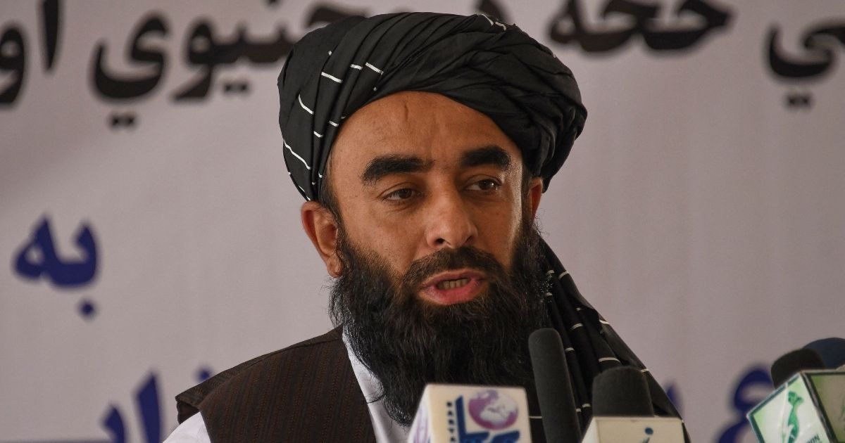 In this Sunday photo, Zabihullah Mujahid, chief spokesman for the Taliban, speaks in Dasht-e-Padula of southern Kabul.