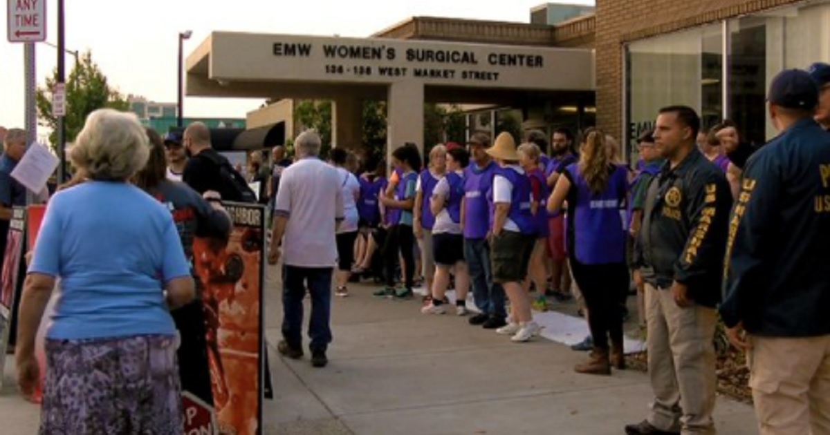 Pro-life activists protest outside the EMW Women's Surgical Center in Louisville, Kentucky.