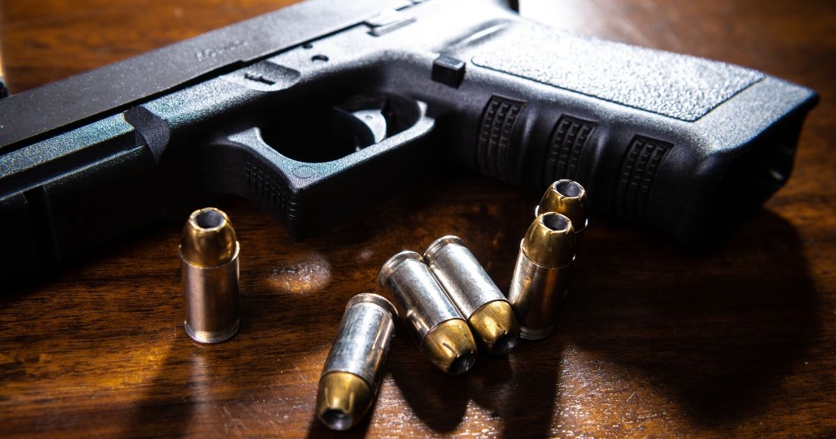 A handgun and bullets are seen in this stock image.