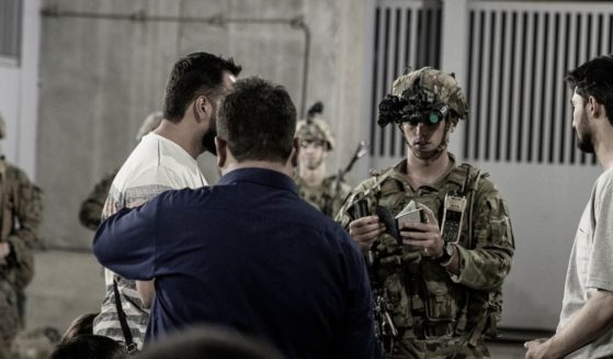 U.S. soldiers with the 82nd Airborne Division assist evacuees at Hamid Karzai International Airport in Kabul, Afghanistan, on Aug. 25.