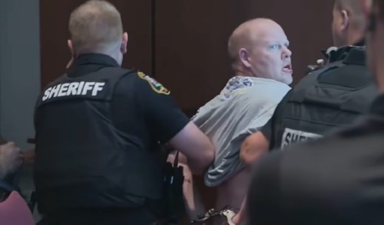 Loudoun County, Virginia, resident Scott Smith is arrested after an altercation at a county school board meeting in June.