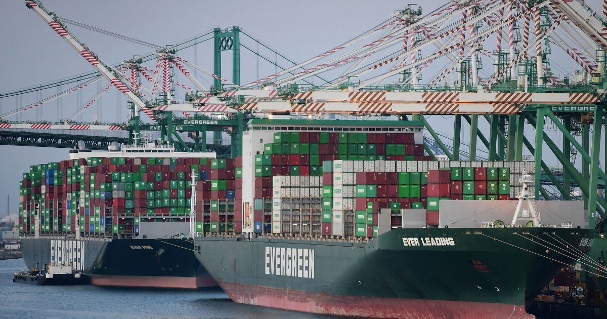 Cargo ships filled with containers dock at the Port of Los Angeles on Tuesday in Los Angeles.