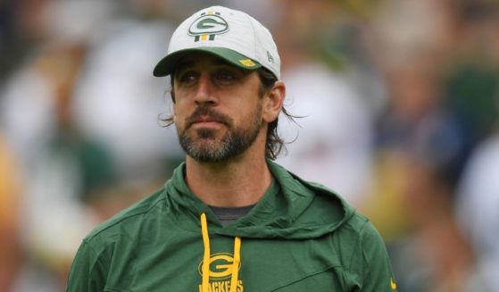 Aaron Rodgers, #12 of the Green Bay Packers, looks on before a preseason game against the New York Jets at Lambeau Field on August 21 in Green Bay, Wisconsin.