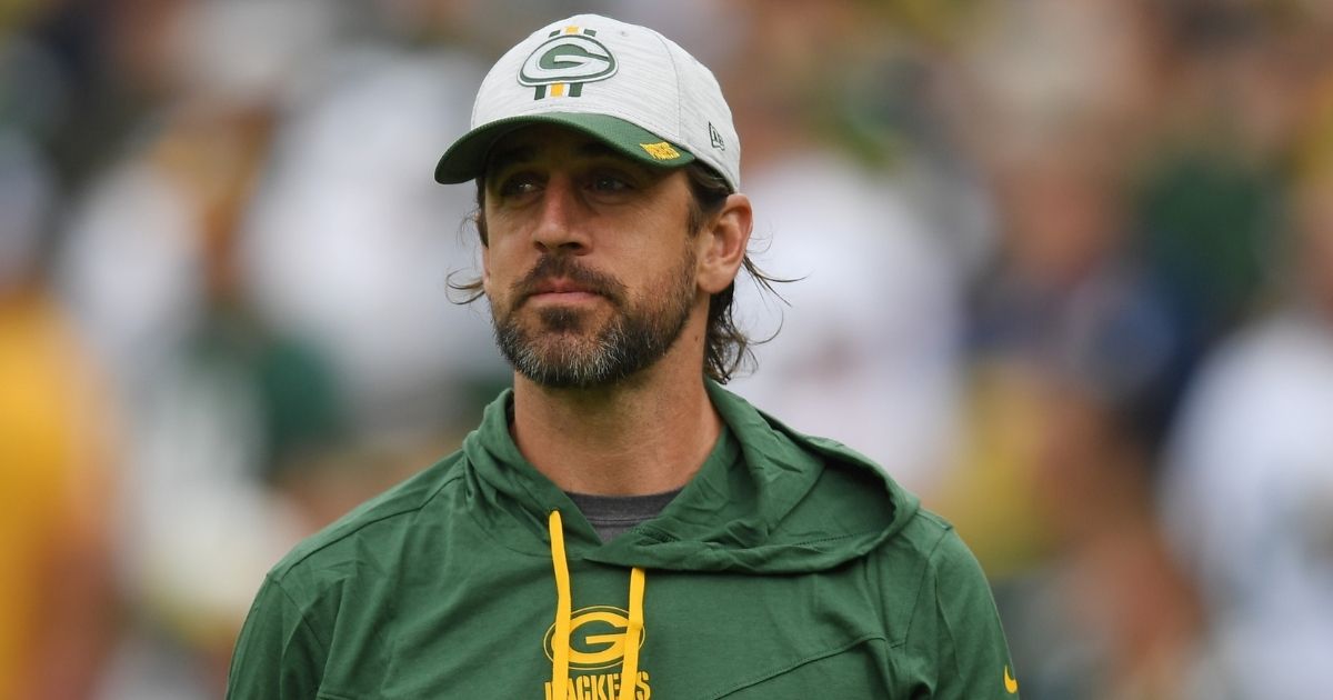 Aaron Rodgers, #12 of the Green Bay Packers, looks on before a preseason game against the New York Jets at Lambeau Field on August 21 in Green Bay, Wisconsin.