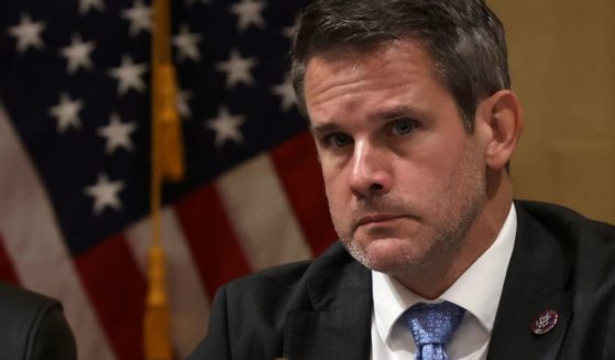 Rep. Adam Kinzinger listens during a committee meeting on Capitol Hill on Oct. 19 in Washington, D.C.