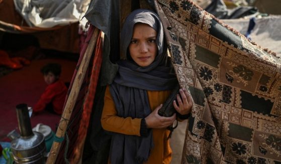 An internally displaced Afghan girl is pictured in the Saray Shamali refugee camp in Kabul on Nov. 2.