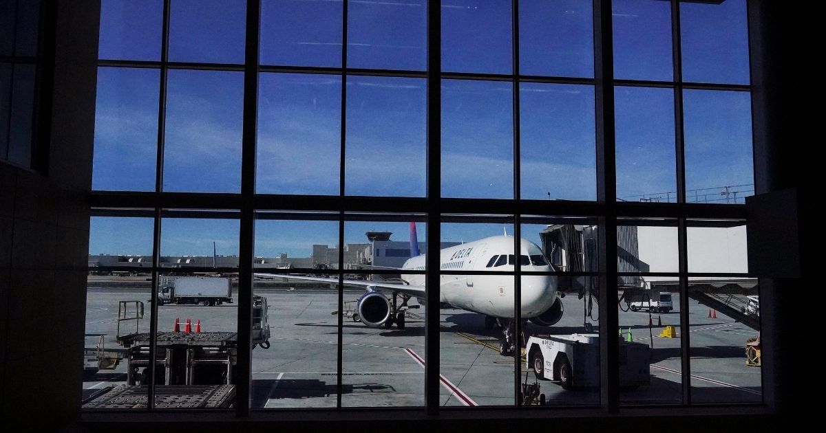 A Delta plane sit at a gate at the Hartsfield-Jackson Atlanta International Airport in Atlanta, Georgia, preparing for a holiday flight on Tuesday.
