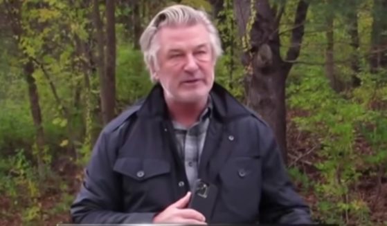 Alec Baldwin speaks to paparazzi on Saturday after they followed him in Manchester, Vermont.