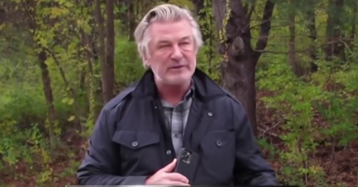 Alec Baldwin speaks to paparazzi on Saturday after they followed him in Manchester, Vermont.