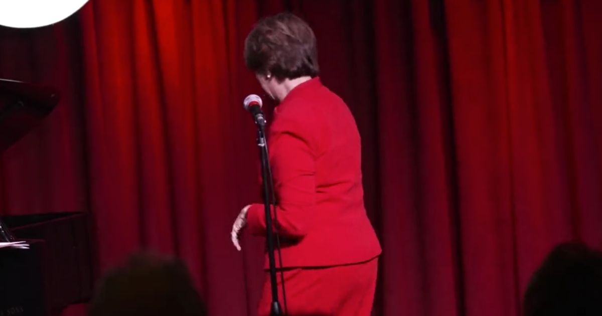 Minnesota Sen. Amy Klobuchar turns away as a group of environmentalist activists protesting against the Line 3 pipeline storm a fundraising event on Thursday.