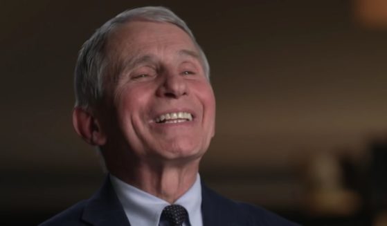Dr. Anthony Fauci laughs while speaking with Margaret Brennan on CBS' Face the Nation.