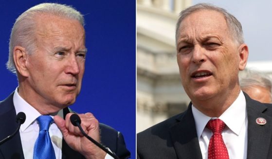 At left, President Joe Biden speaks during COP26 in Glasgow, Scotland, on Tuesday. Republican Rep. Andy Biggs of Arizona, chairman of the House Freedom Caucus, speaks during a news conference outside the U.S. Capitol in Washington on July 29.