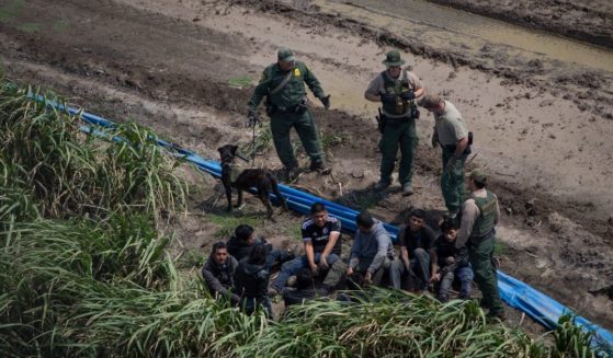 US Border Patrol agents apprehend illegal immigrants in Texas near the US border with Mexico in this file photo from March 2018. Border Patrol agents announced the arrest this week of four suspected MS-13 gang members and two previously-deported illegal immigrants.