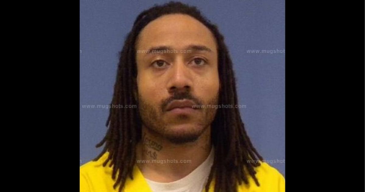 A man identified as Darrell Brooks is seen in a police mugshot.
