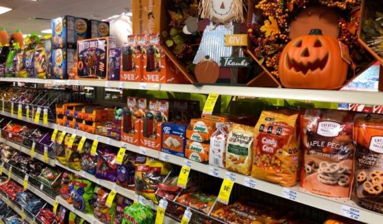 A store in Freeport, Maine has an aisle of Halloween candy and fall decorations displayed.