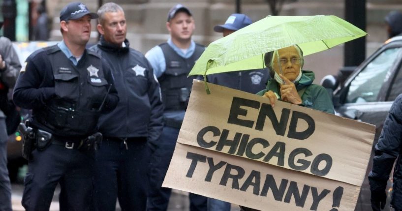 Chicago police officers join other city workers and their supporters Oct. 25, 2021, to protest the mayor's citywide employee vaccination policy.