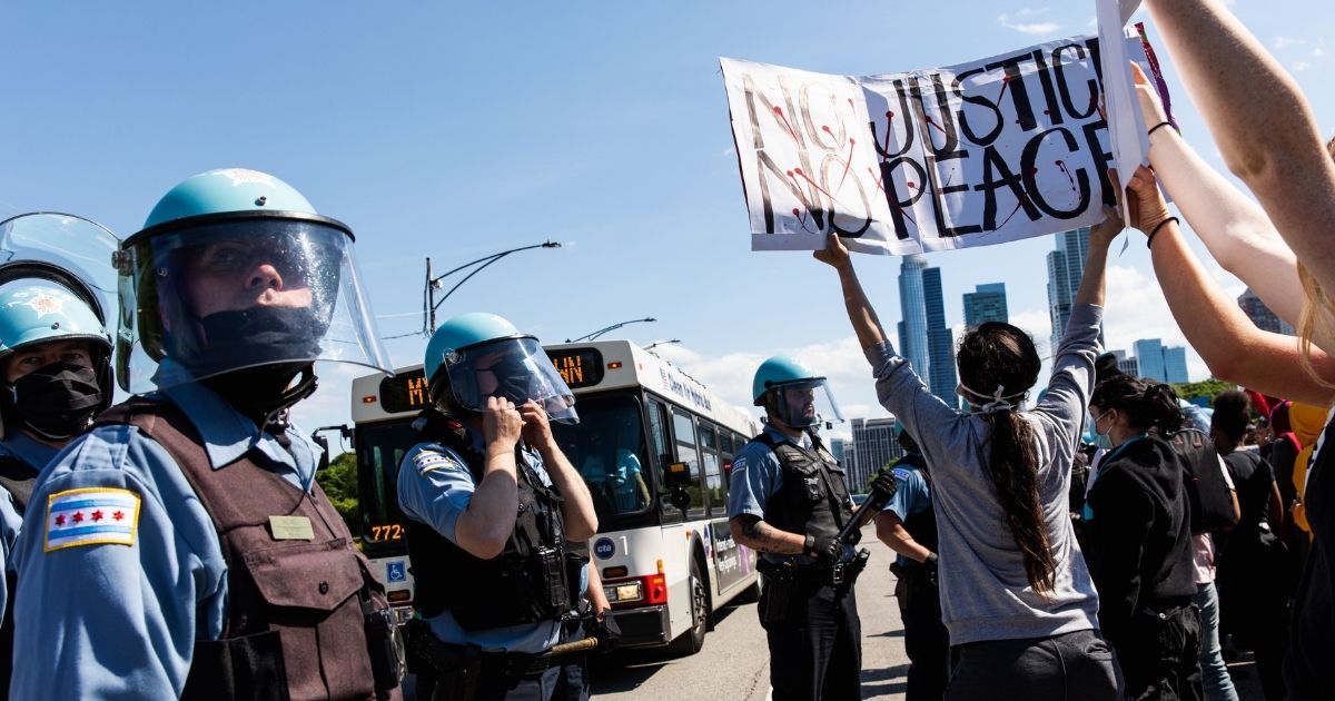 Demonstrators confront Chicago police officers during a march from the city's Federal Plaza on May 30, 2020, following the death of George Floyd in Minneapolis police custody.