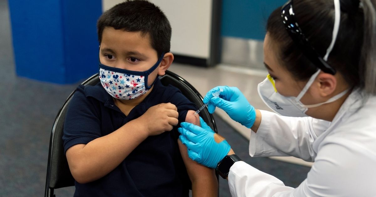 Six-year-old Eric Aviles receives his COVID vaccine at the pediatric vaccine clinic at Willard Intermediate School in Santa Ana, California, on Nov. 9.