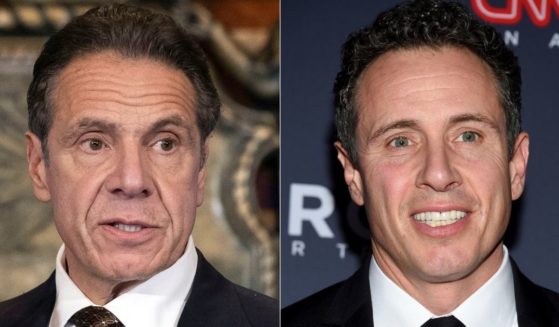 In this combination of photos, former New York Gov. Andrew Cuomo, left, appears during a news conference about COVID-19 at the State Capitol in Albany, New York, on Dec. 3, 2020, and his brother CNN anchor Chris Cuomo attends the 12th annual CNN Heroes: An All-Star Tribute at the American Museum of Natural History in New York on Dec. 9, 2018.