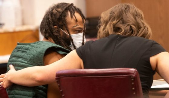 Darrell Brooks, accused of killing six people and injuring dozens of others by driving through a Christmas parade, appears in Waukesha County Court in Waukesha, Wisconsin, on Tuesday.
