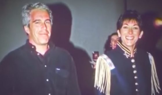 Jeffrey Epstein, left, and Ghislaine Maxwell are photographed walking together at an event in New York in 1995.