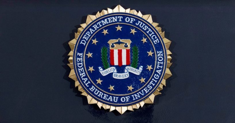 The FBI seal is seen on a podium before a news conference at the agency's headquarters in Washington, D.C., on June 14, 2018.