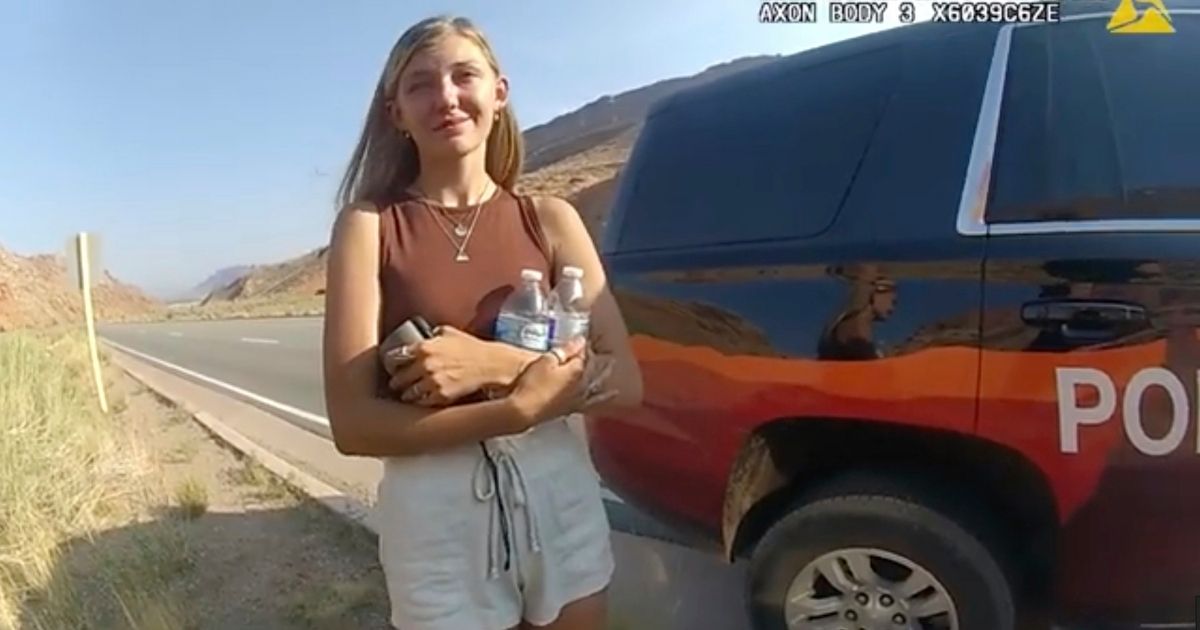 Gabrielle "Gabby" Petito talks to an officer after police pulled over the van she was traveling in with her boyfriend, Brian Laundrie, near the entrance to Arches National Park in Utah on Aug. 12.
