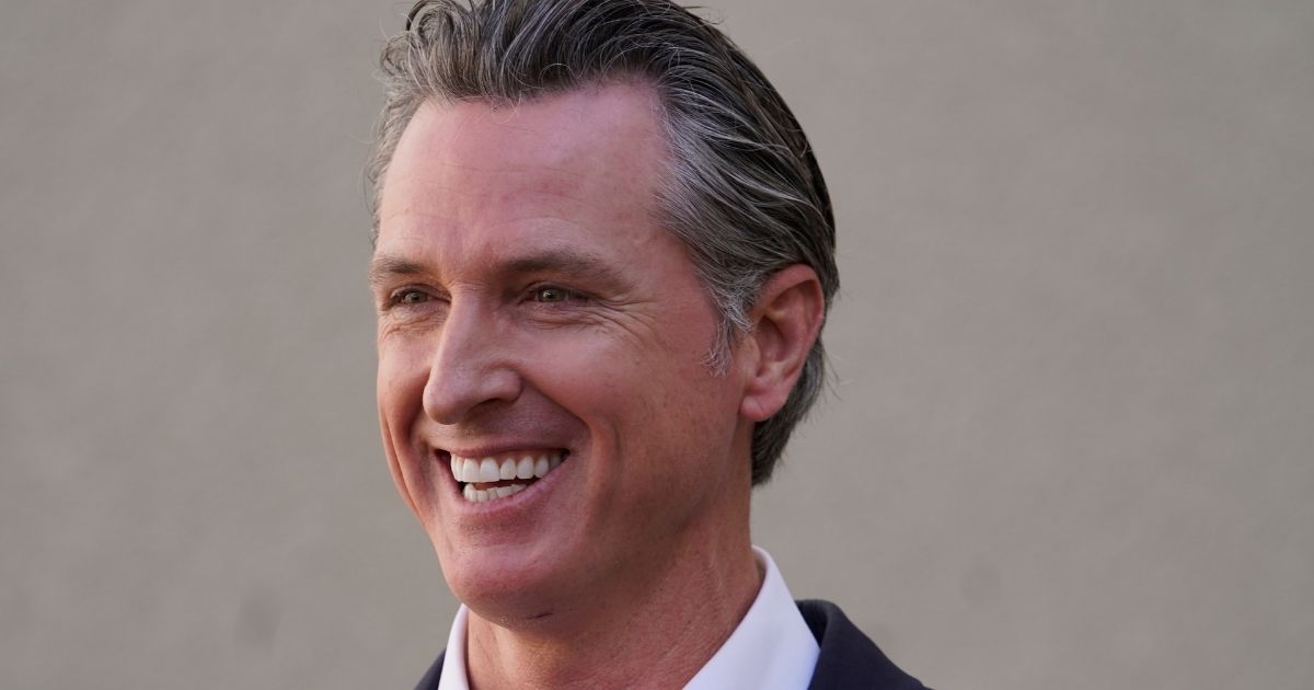 Democratic California Gov. Gavin Newsom takes questions from reporters in Los Angeles after visiting a COVID-19 vaccine clinic on Nov. 10.