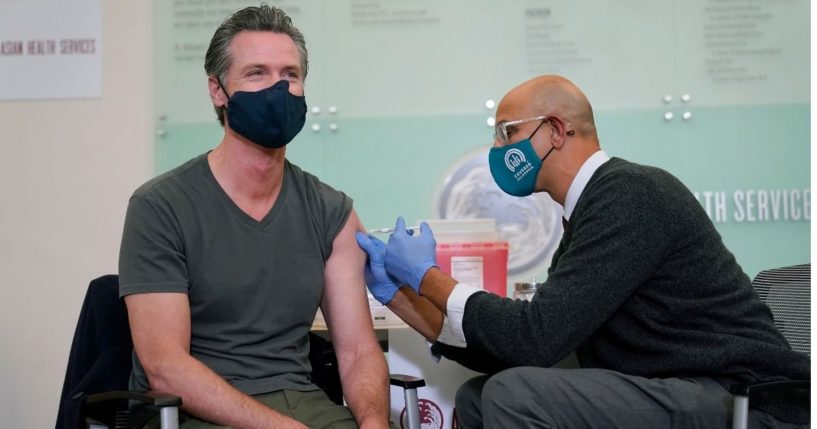 California Gov. Gavin Newsom receives his Covid booster shot in Oakland, California, during his last public appearance on Wednesday, Oct. 27.