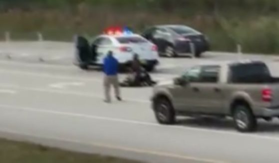 A man named Ashad Russell is seen approaching a man beating a sheriff's deputy in November 2016 in Florida.