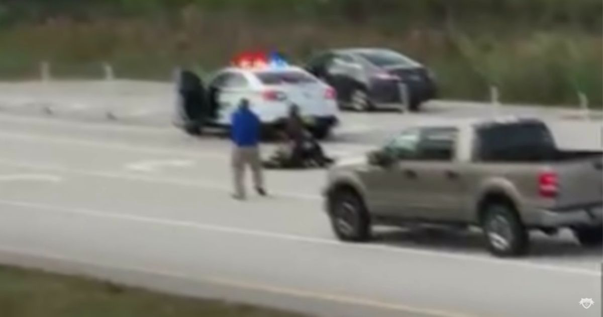 A man named Ashad Russell is seen approaching a man beating a sheriff's deputy in November 2016 in Florida.
