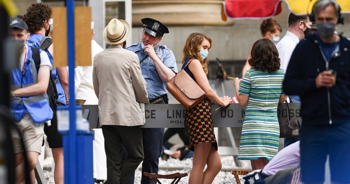 Cast, extras and crew members continue the filming in Glasgow City centre for the new Indiana Jones five movie on July 16 in Glasgow, Scotland.