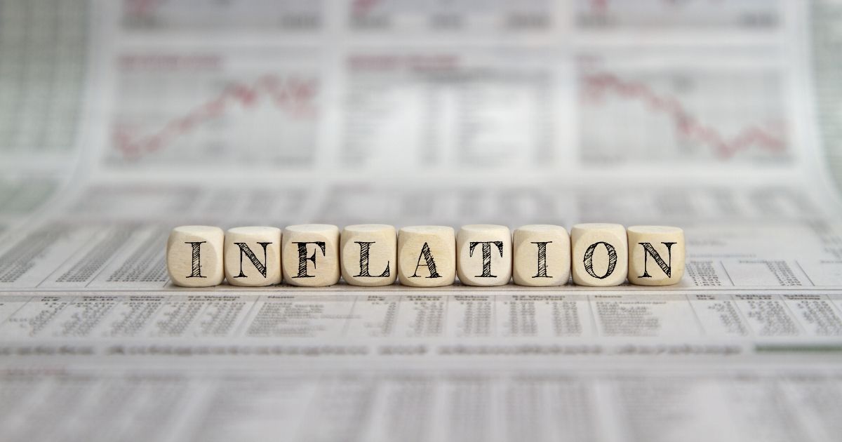 The word "inflation" is pictured on wooden blocks in the stock image above.