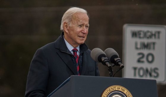 President Joe Biden delivers a speech on infrastructure while visiting the NH 175 bridge spanning the Pemigewasset River on Tuesday in Woodstock, New Hampshire.