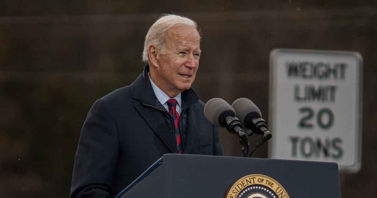 President Joe Biden delivers a speech on infrastructure while visiting the NH 175 bridge spanning the Pemigewasset River on Tuesday in Woodstock, New Hampshire.