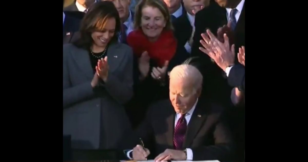 President Joe Biden signs the $1.2 trillion infrastructure bill into law on Monday.