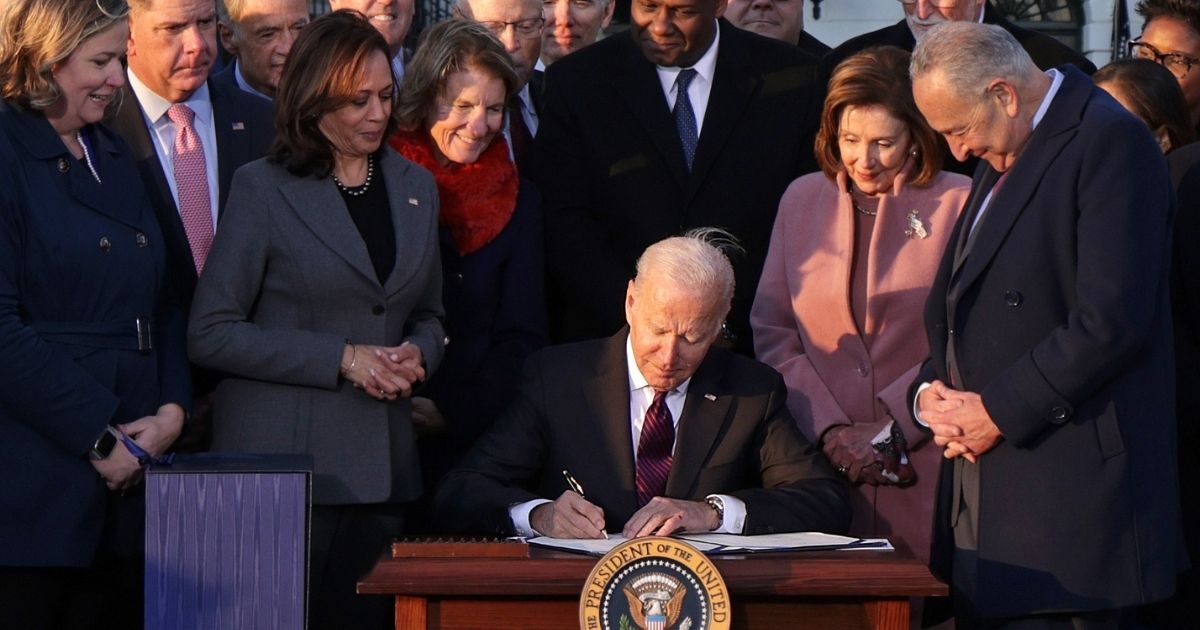 President Joe Biden signs the Infrastructure Investment and Jobs Act on the South Lawn of the White House on Monday in Washington, D.C.