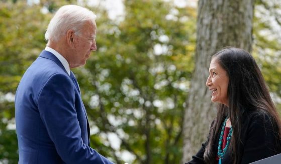 President Joe Biden, left, and Interior Secretary Deb Haaland shake hands outside on the White House on Oct. 8 before Biden gives a speech restoring protections for two national monuments in Utah and a marine conservation area in New England.