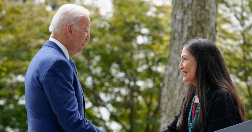 President Joe Biden, left, and Interior Secretary Deb Haaland shake hands outside on the White House on Oct. 8 before Biden gives a speech restoring protections for two national monuments in Utah and a marine conservation area in New England.