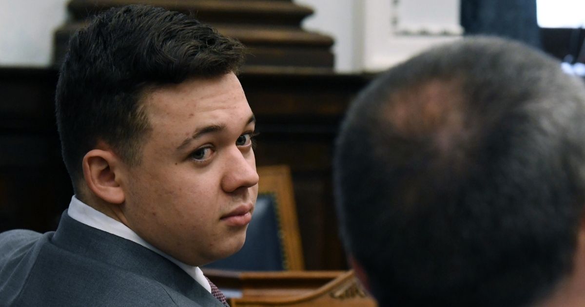 Kyle Rittenhouse looks over his shoulder across the courtroom Friday during his trial in Kenosha, Wisconsin. The judge in the case dismissed one of the charges against Rittenhouse Monday.