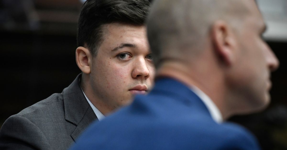 Kyle Rittenhouse listens as Judge Bruce Schroeder talks about how the jury will view video during deliberations in the teenager's trial at the Kenosha County Courthouse on Wednesday in Kenosha, Wisconsin.